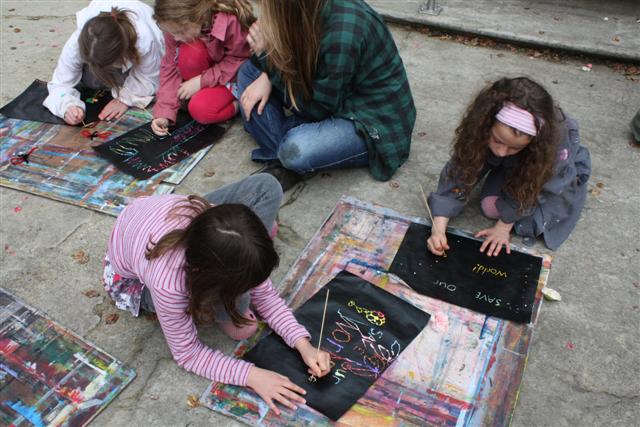 Children making art outside at Inverlochy